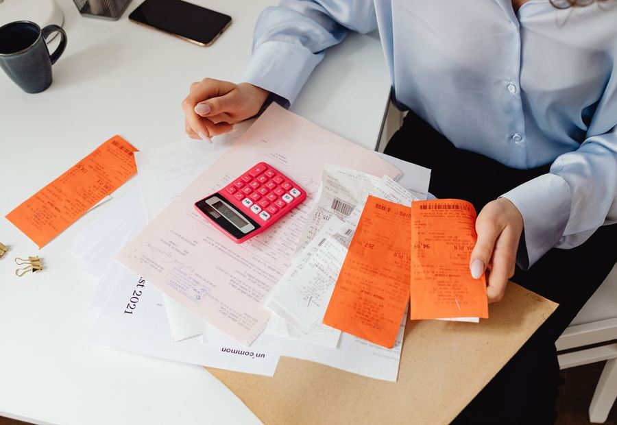 Sorting receipts and invoices with a calculator