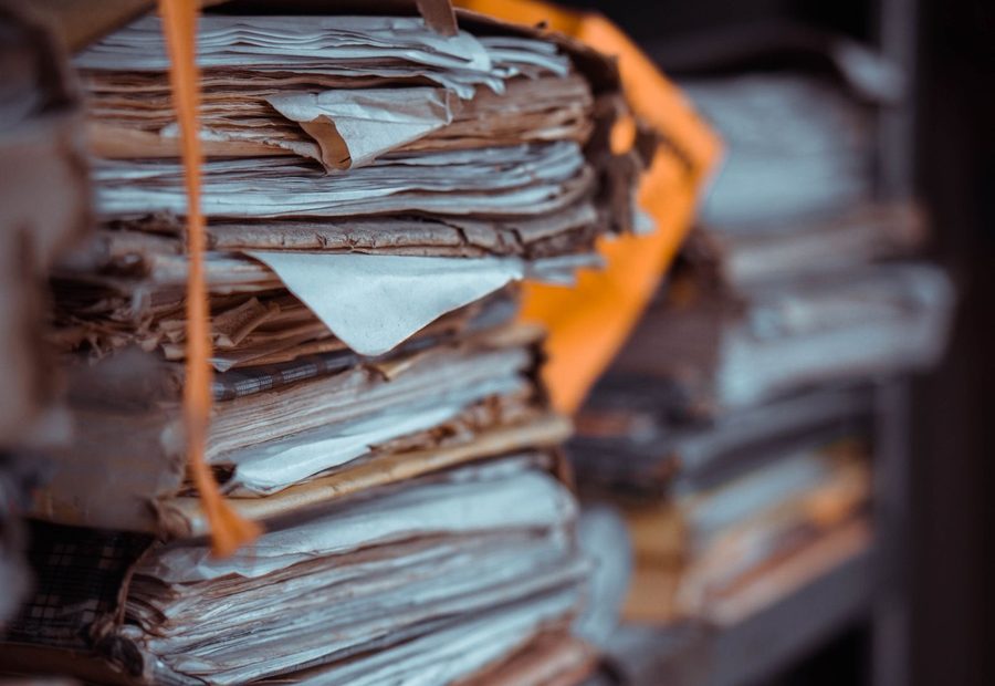 Years of business records stacked in an office archive