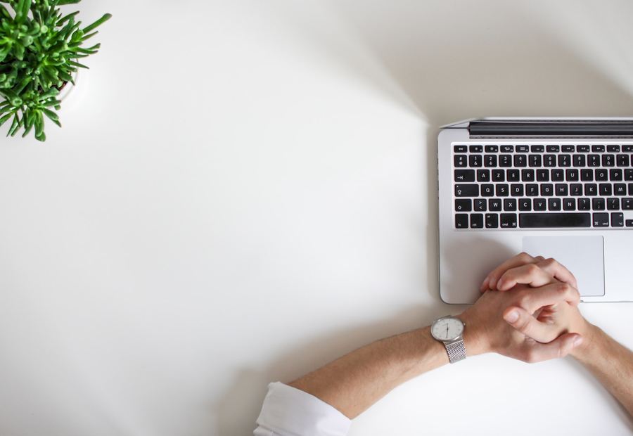 Working through payroll figures on a laptop
